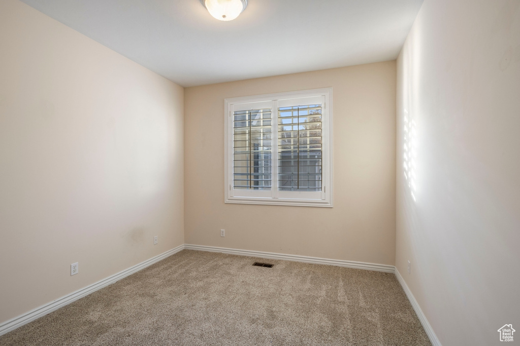 View of carpeted spare room