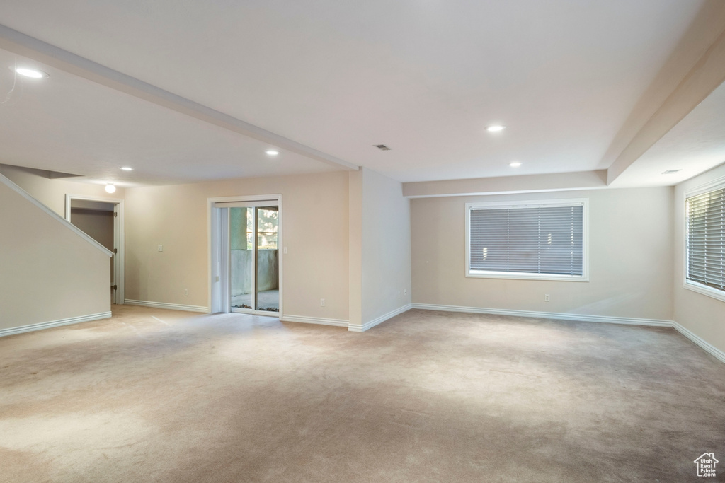 Spare room with light colored carpet