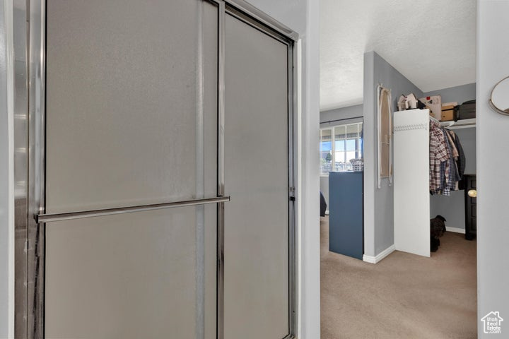 Bathroom with a shower with shower door