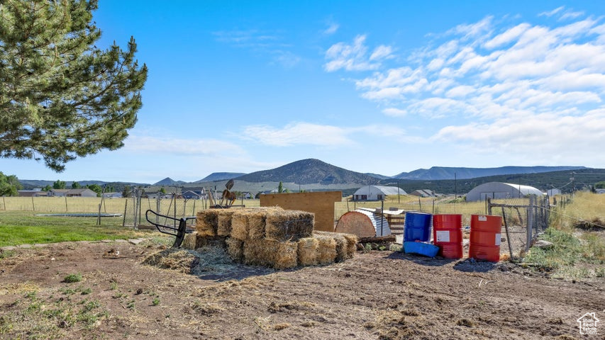 View of yard featuring a mountain view and a rural view