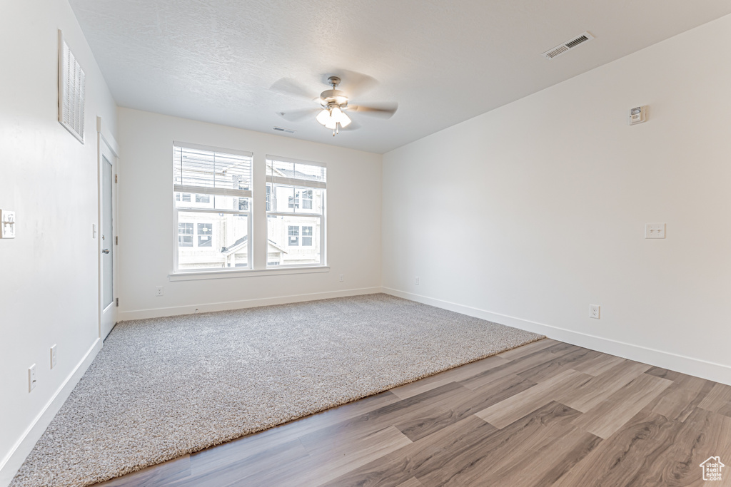 Spare room with ceiling fan and wood finished floors