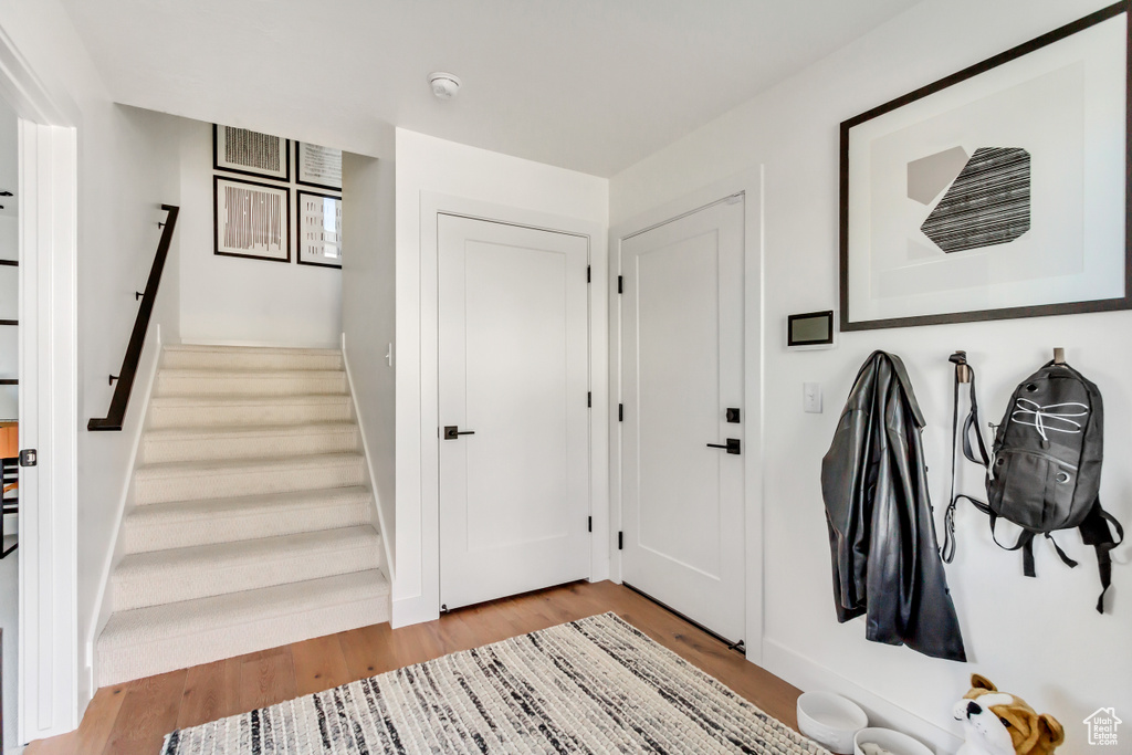 Mudroom with light hardwood / wood-style floors