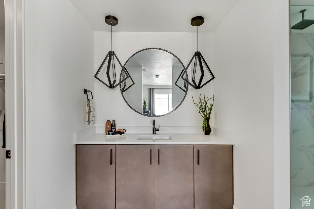 Bathroom with vanity and a shower