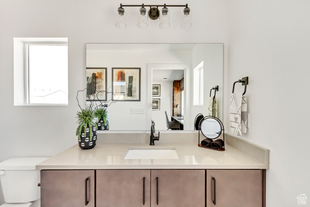 Bathroom featuring vanity and toilet