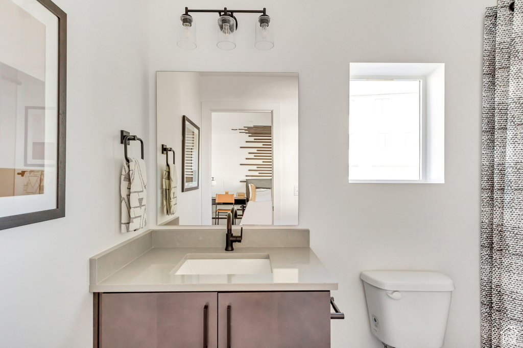 Bathroom with toilet and vanity