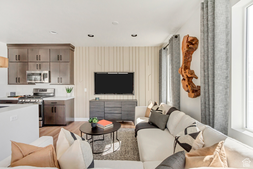 Living room with light hardwood / wood-style flooring