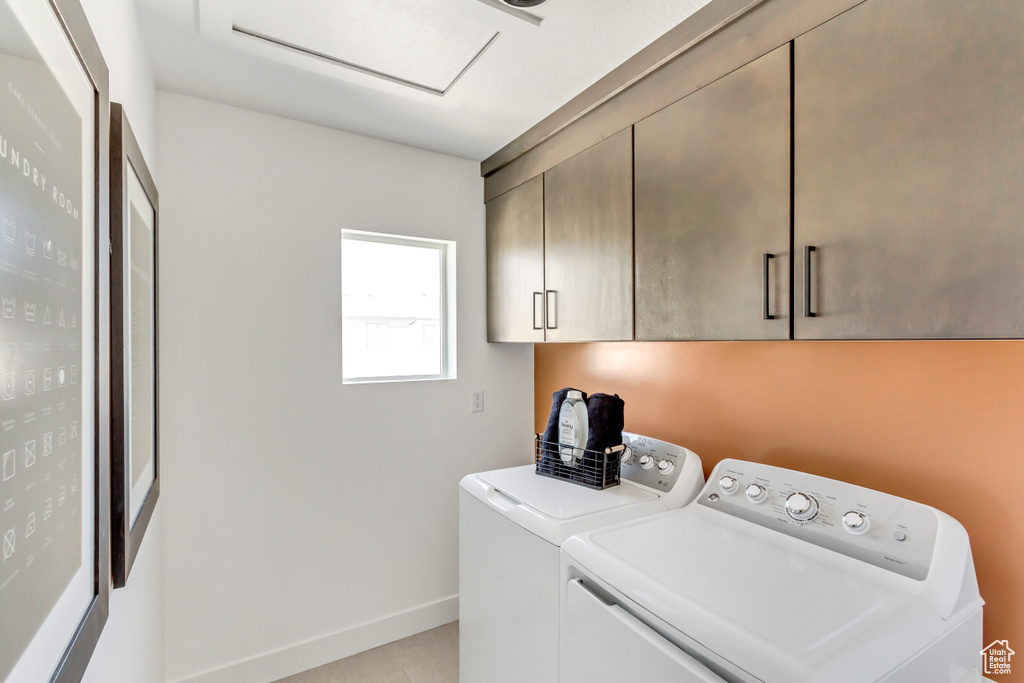 Clothes washing area with washing machine and clothes dryer and cabinets