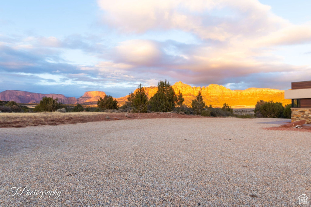 Yard at dusk with a mountain view