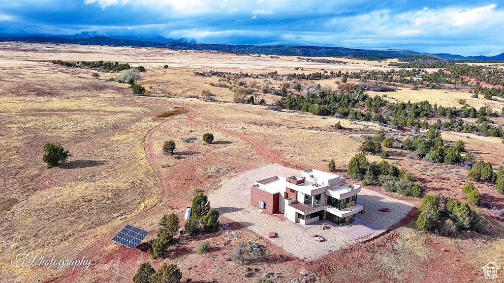 Birds eye view of property with a mountain view