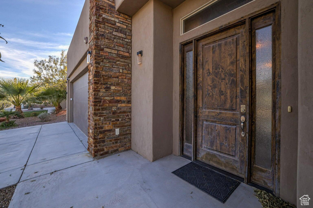 Property entrance featuring a garage