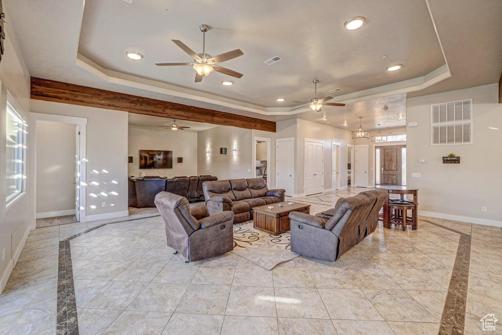 Living room featuring a raised ceiling