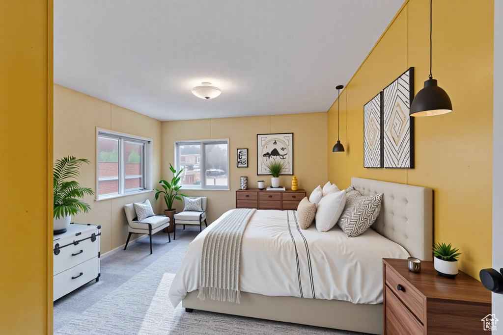 Bedroom featuring light carpet