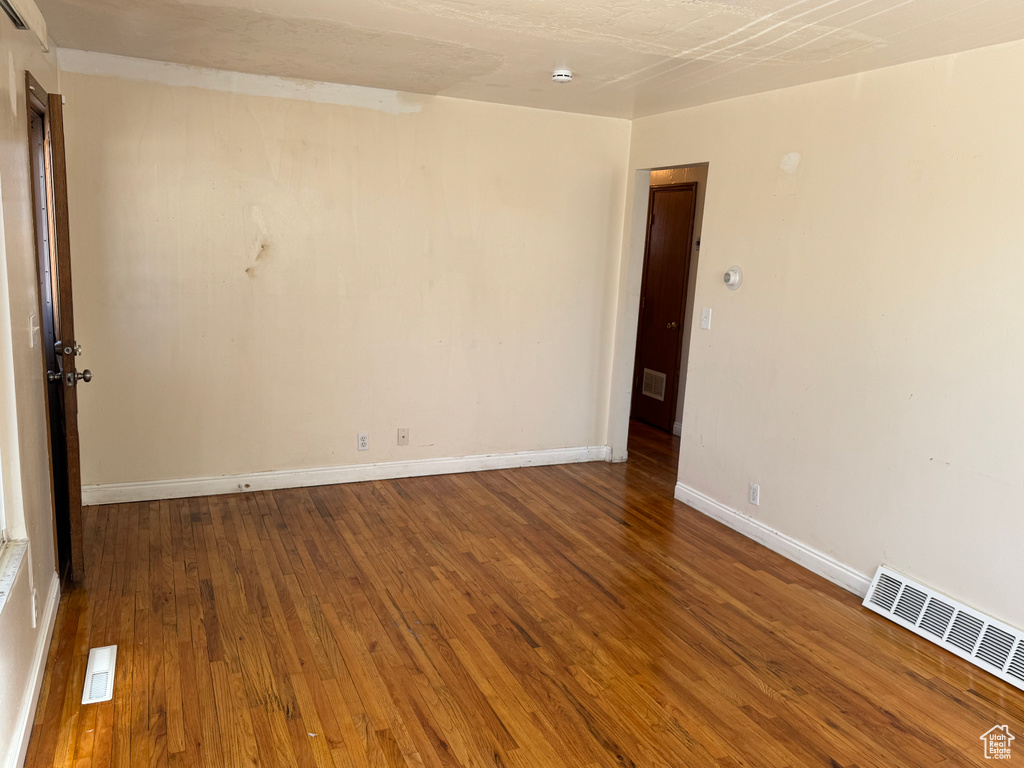 Unfurnished room featuring wood-type flooring