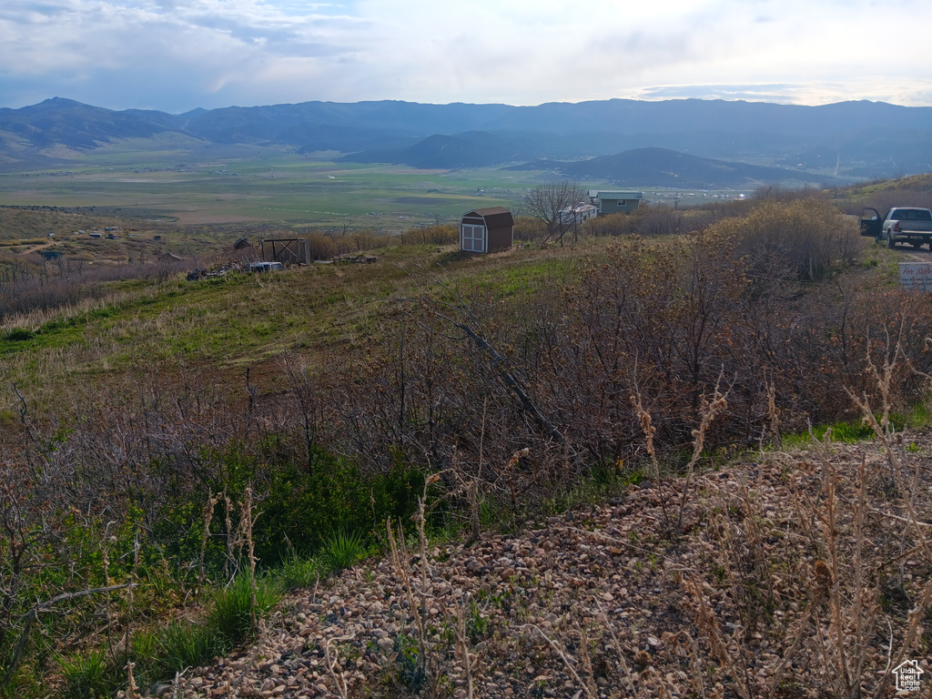 View of mountain background featuring rural landscape