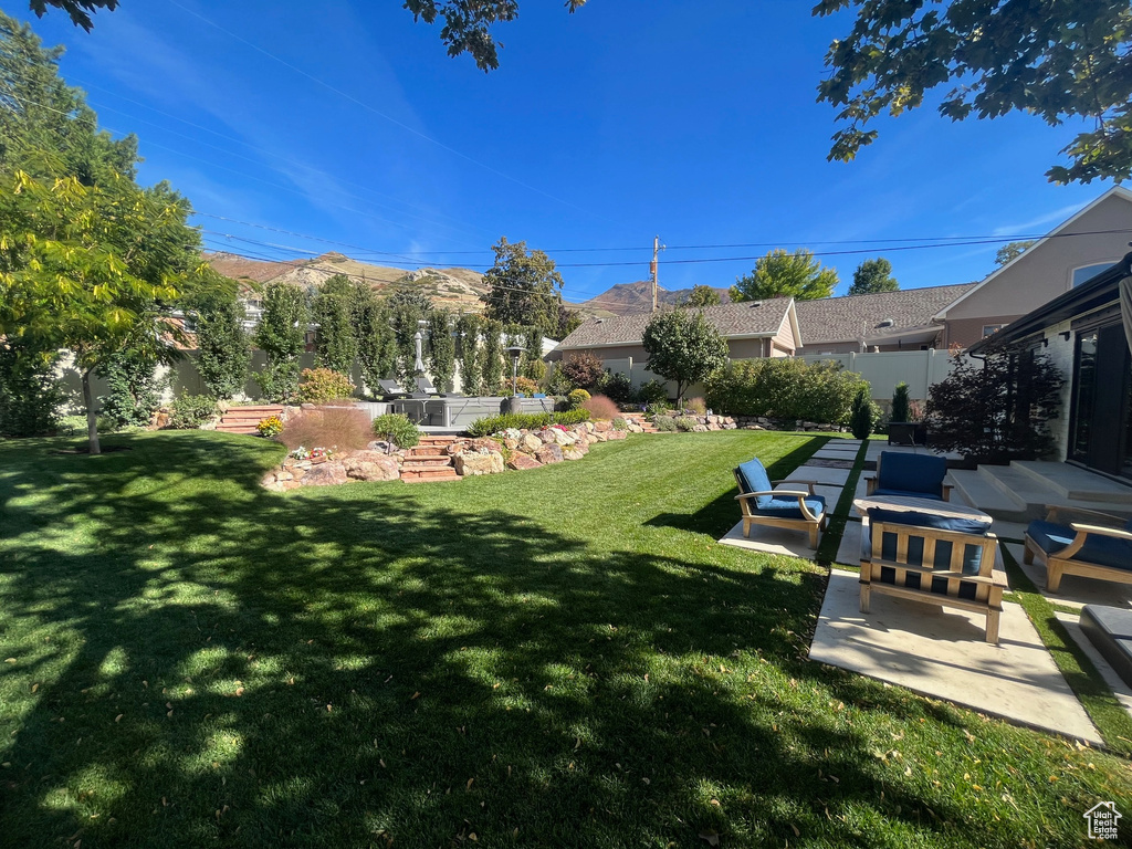 View of yard with a patio