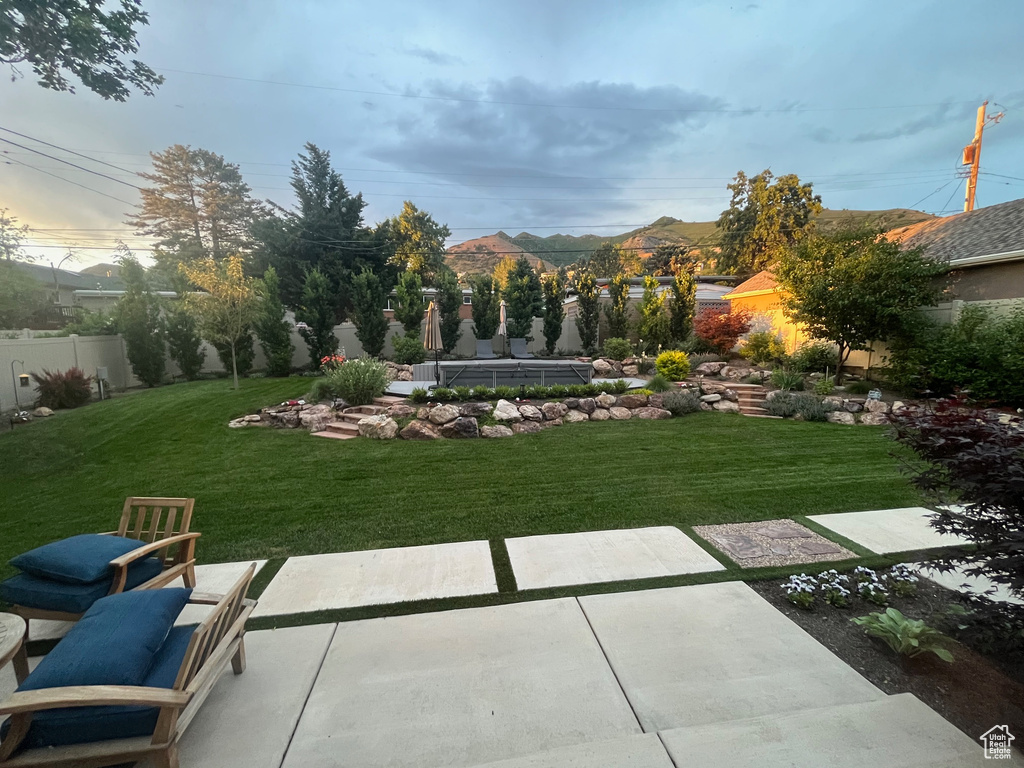 View of yard featuring a mountain view and a patio