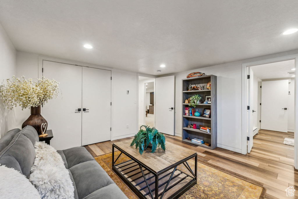 Living room with light hardwood / wood-style floors