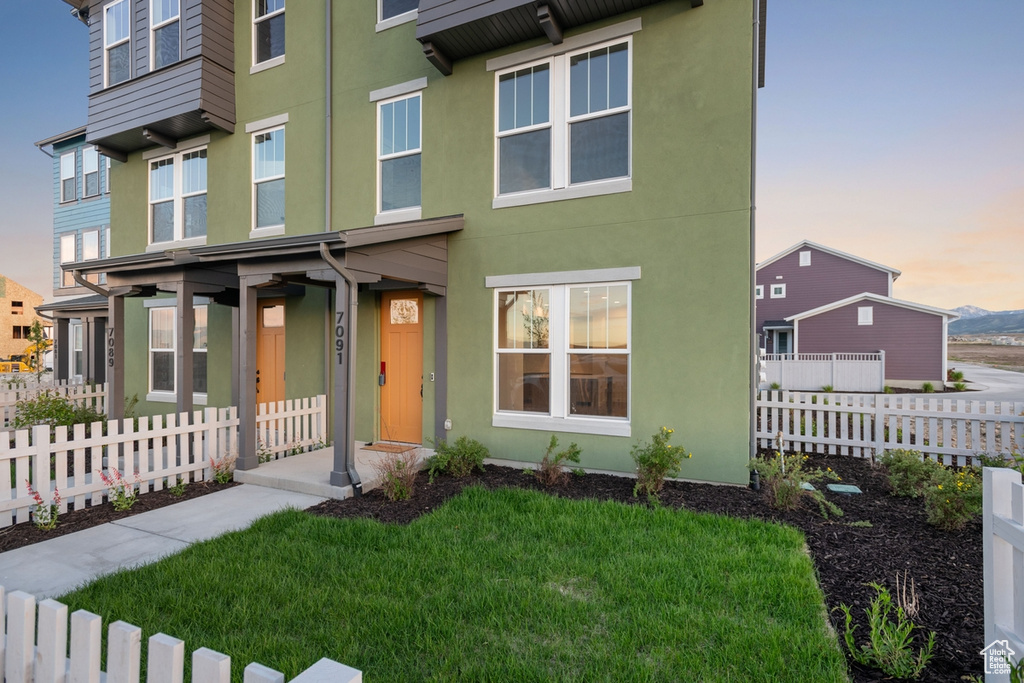 View of front of home featuring stucco siding