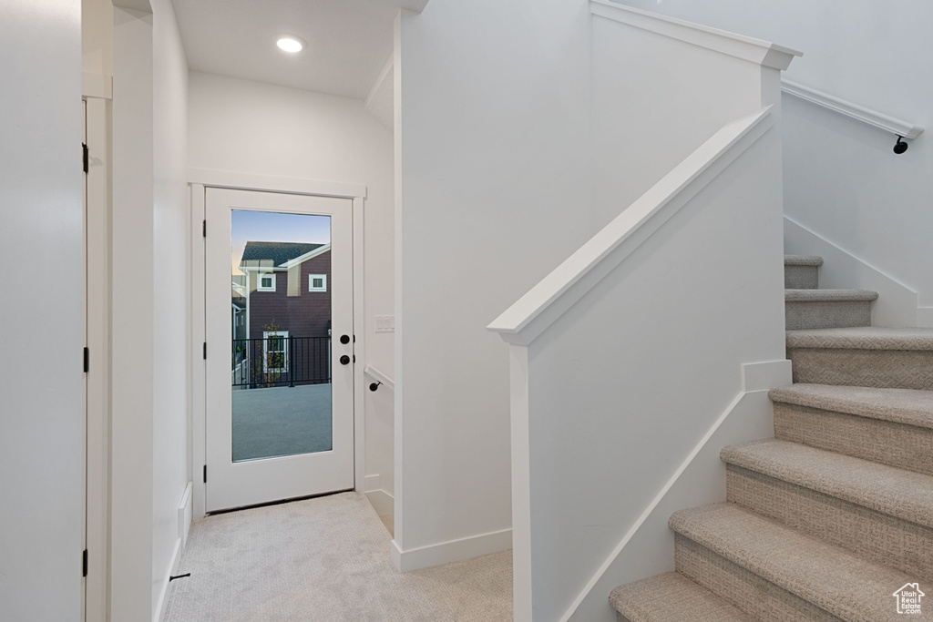 Stairway with carpet flooring, baseboards, and recessed lighting