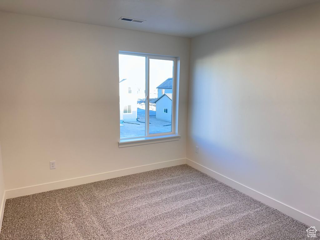 Empty room with carpet flooring