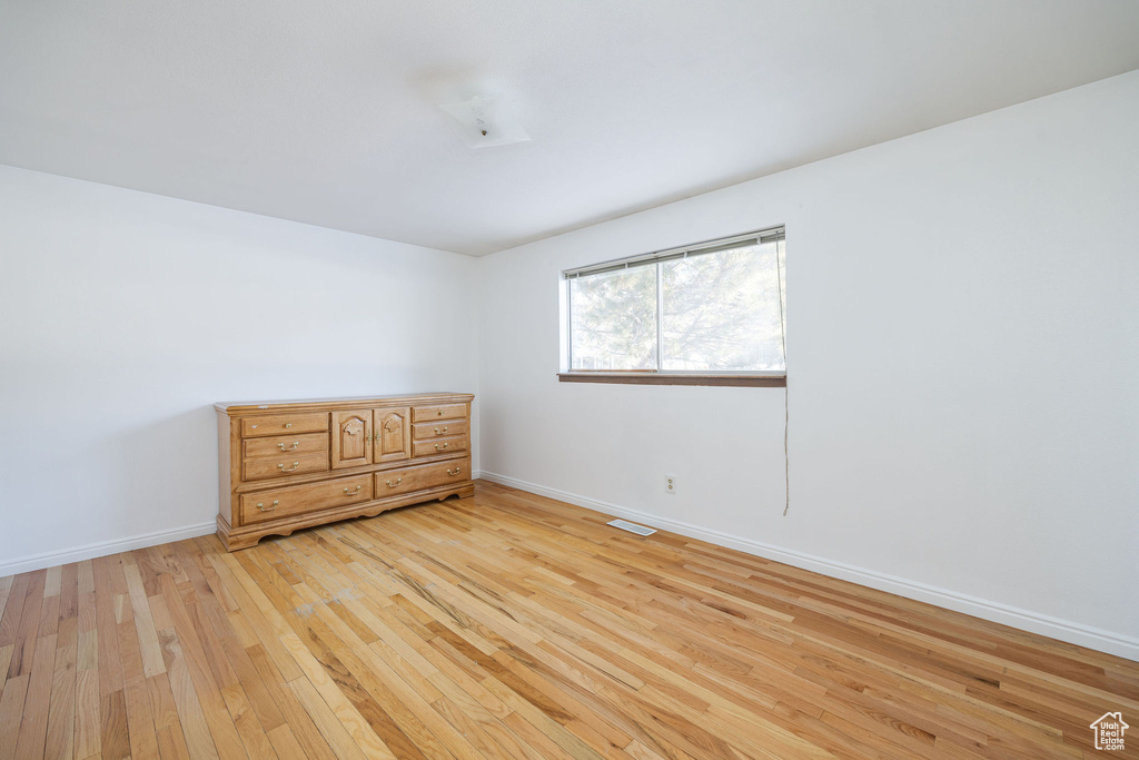 Spare room featuring light hardwood / wood-style flooring