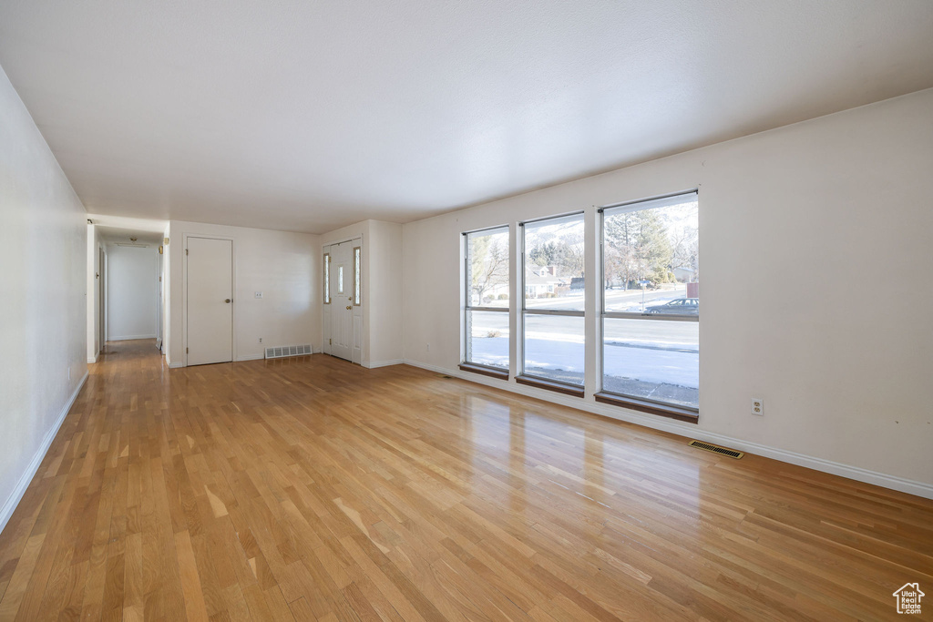 Empty room featuring light hardwood / wood-style flooring