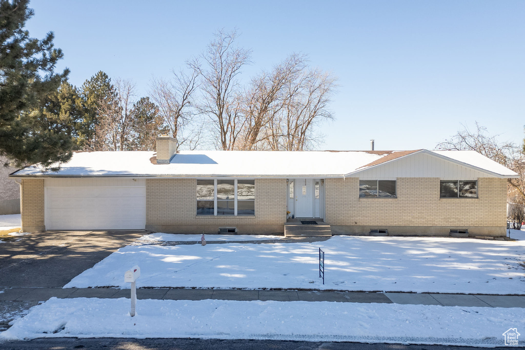 Single story home featuring a garage