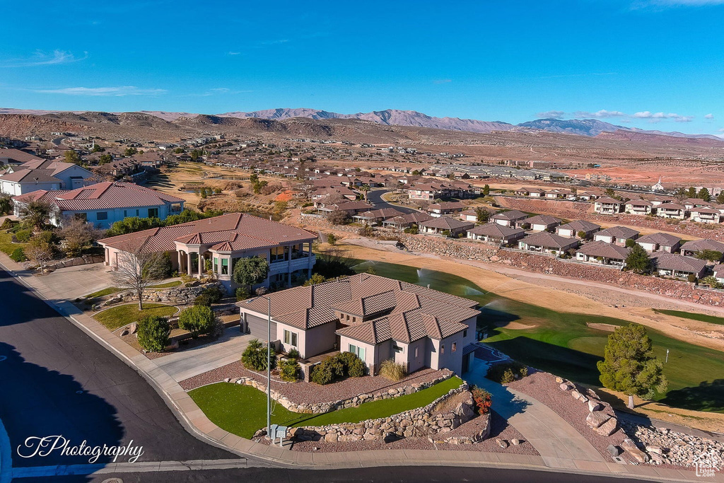 Birds eye view of property with a mountain view