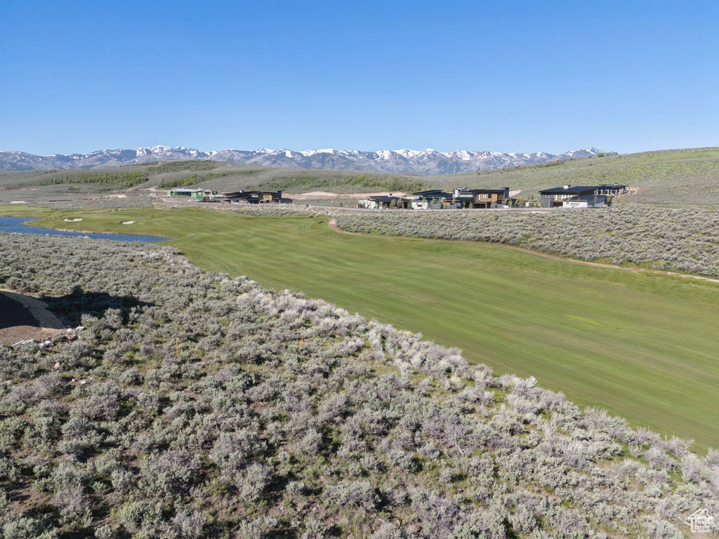 Surrounding community featuring a mountain view and view of golf course