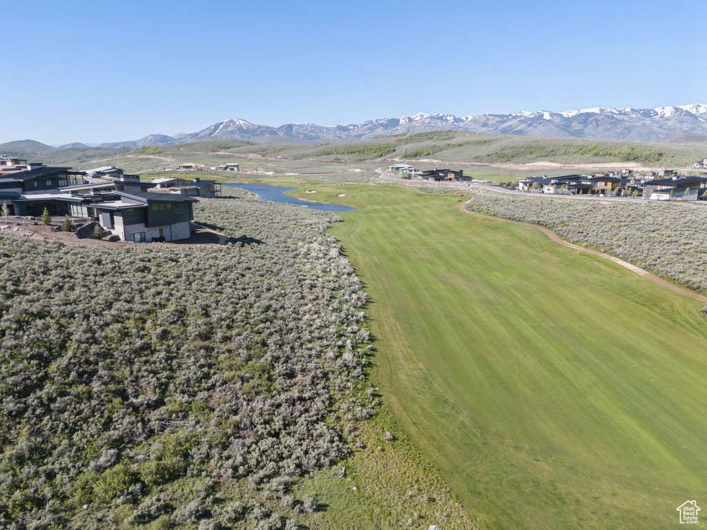 Aerial view of a water and mountain view and a golf course
