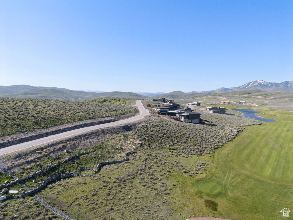 Aerial view of a water and mountain view and a golf club