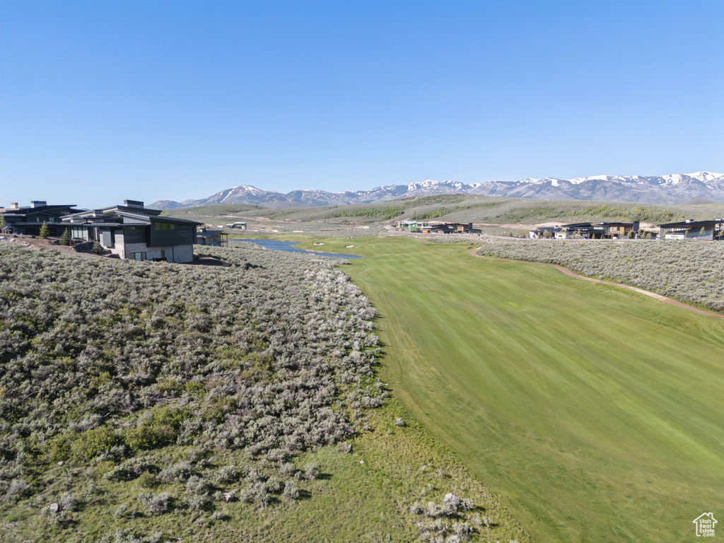 View of yard featuring a mountain view and golf course view
