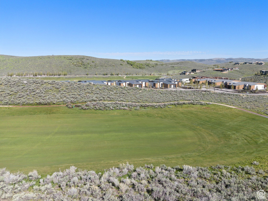 View of home's community with a mountain view and golf course view