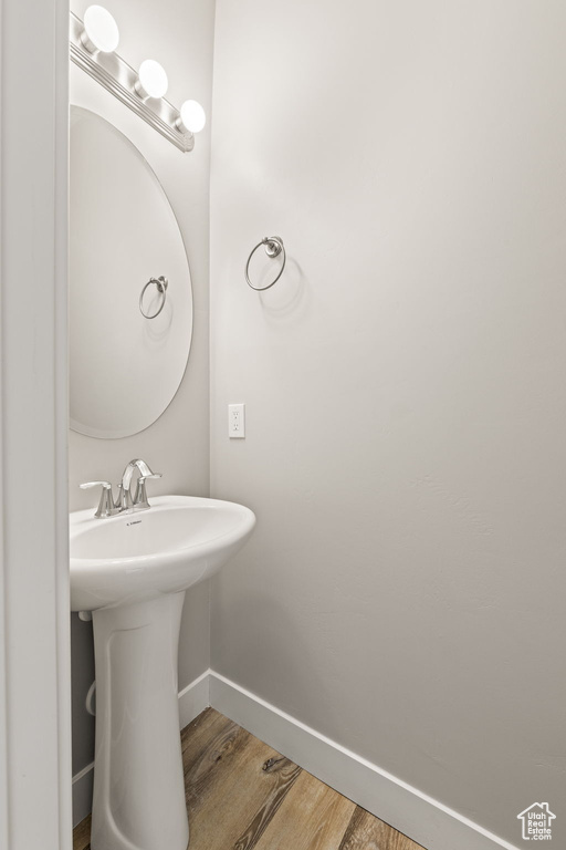 Bathroom featuring sink and hardwood / wood-style floors