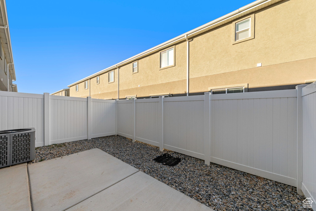 View of patio featuring cooling unit