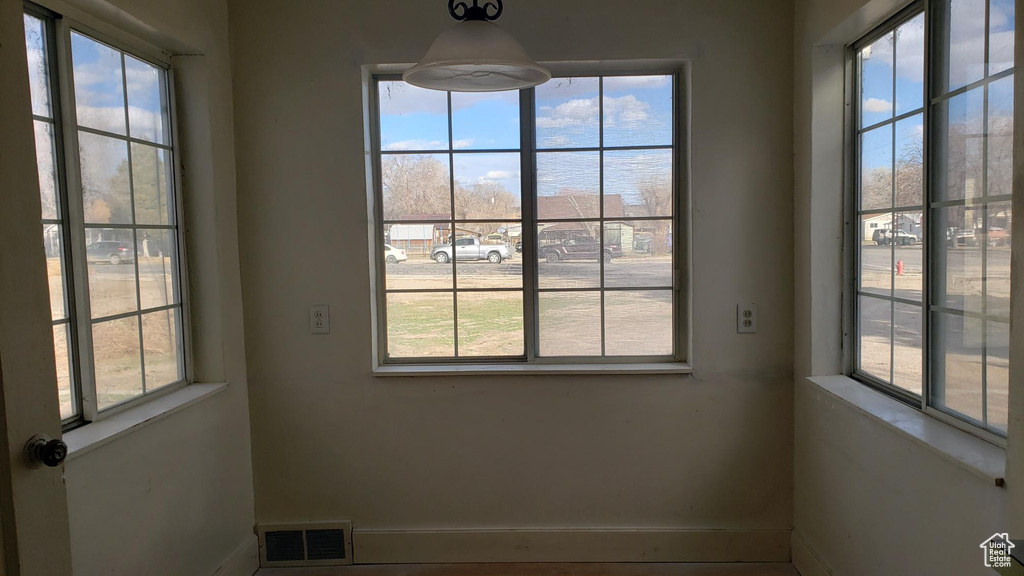 Interior space featuring baseboards and visible vents
