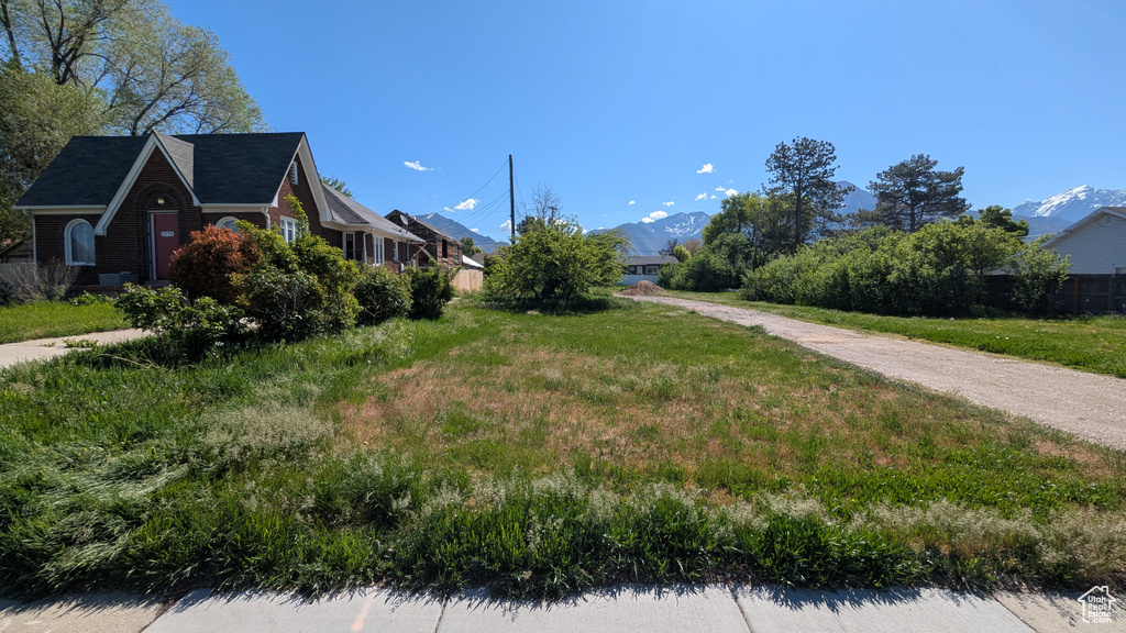 View of property exterior featuring a mountain view