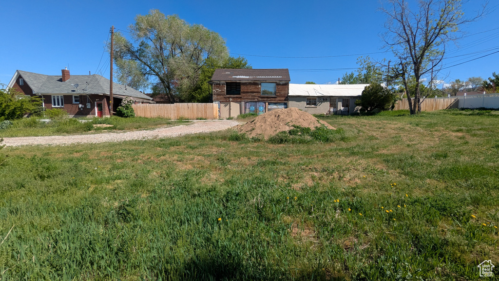 View of yard featuring fence