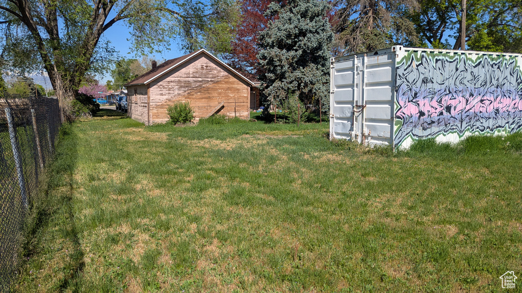 View of yard featuring fence