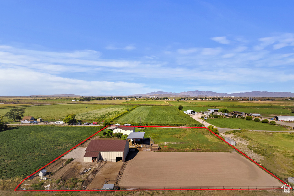 Birds eye view of property with a mountain view and a rural view
