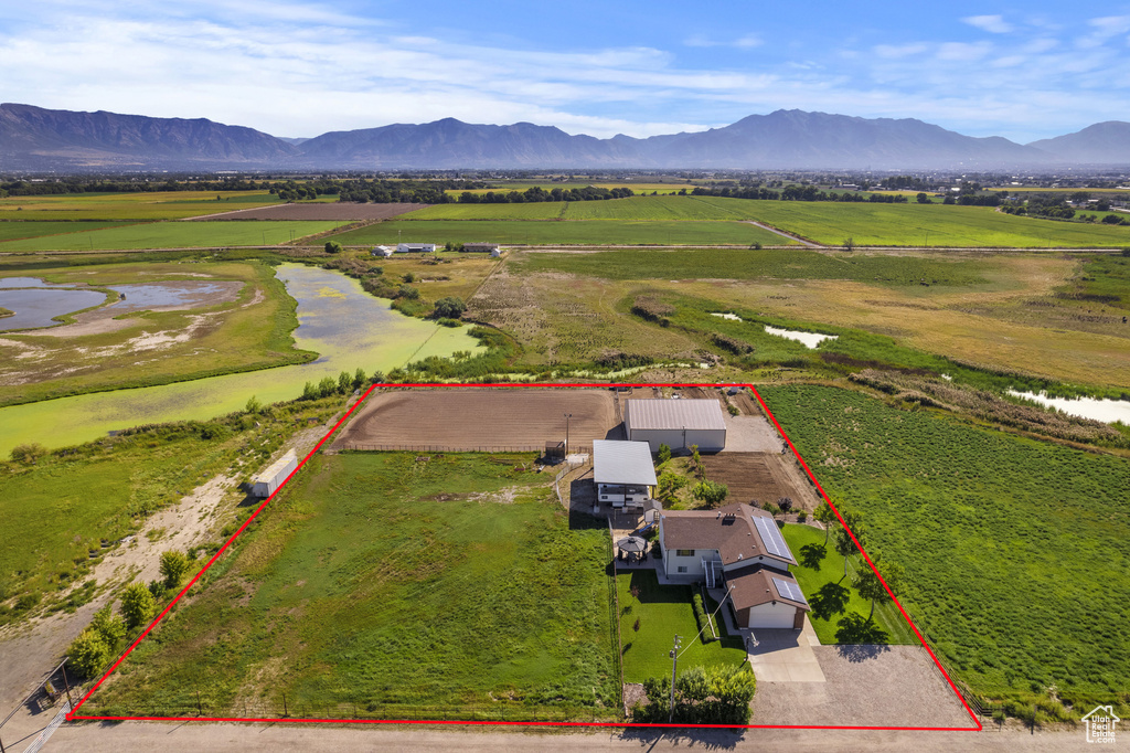 Birds eye view of property with a mountain view and a rural view