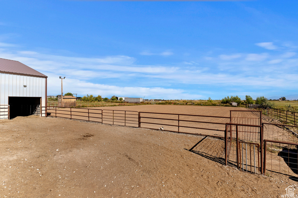 View of yard with a rural view