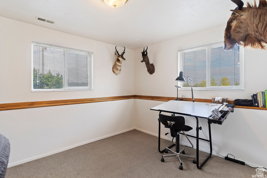 View of carpeted home office