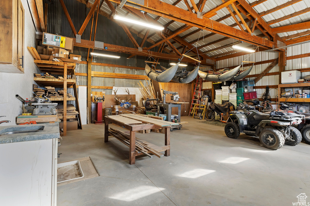 Garage featuring sink and a workshop area