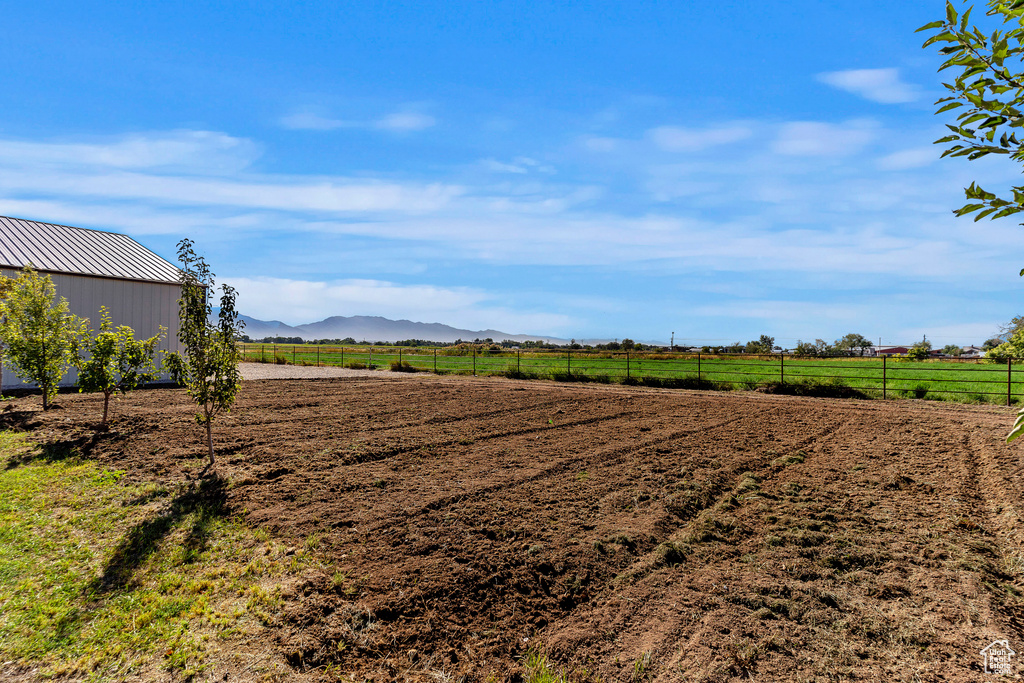 View of yard featuring a mountain view and a rural view