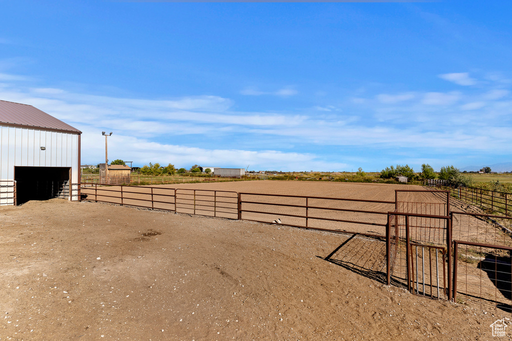 View of yard with a rural view