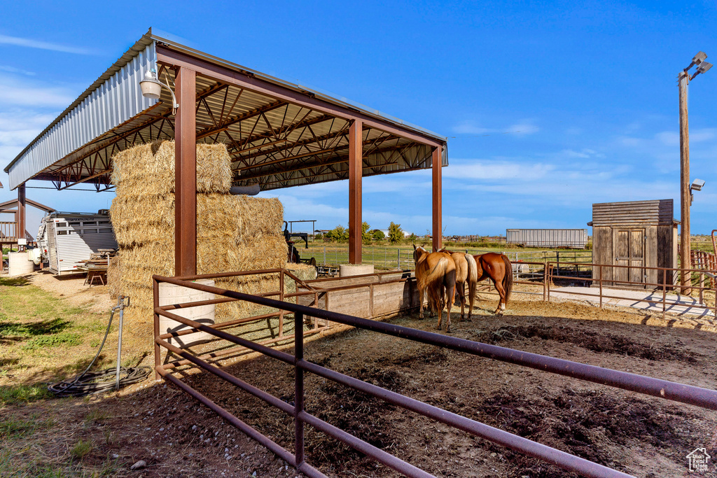Exterior space with a rural view and an outdoor structure