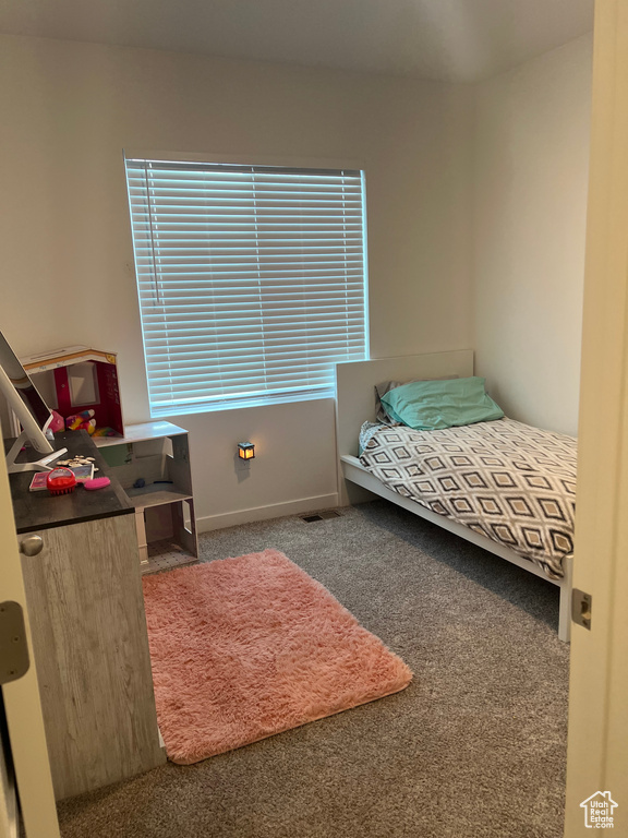 Bedroom featuring carpet