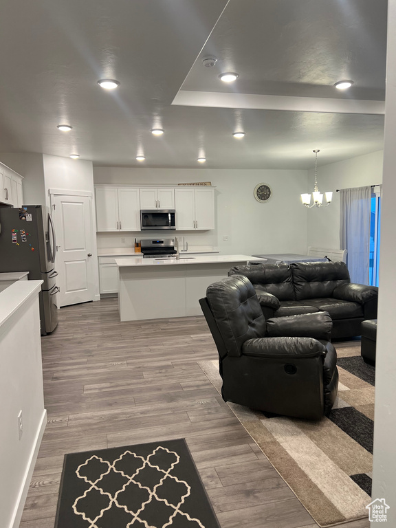 Living room featuring a notable chandelier