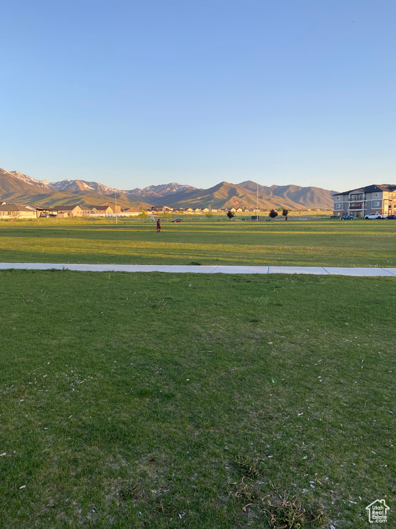 View of mountain backdrop with rural landscape